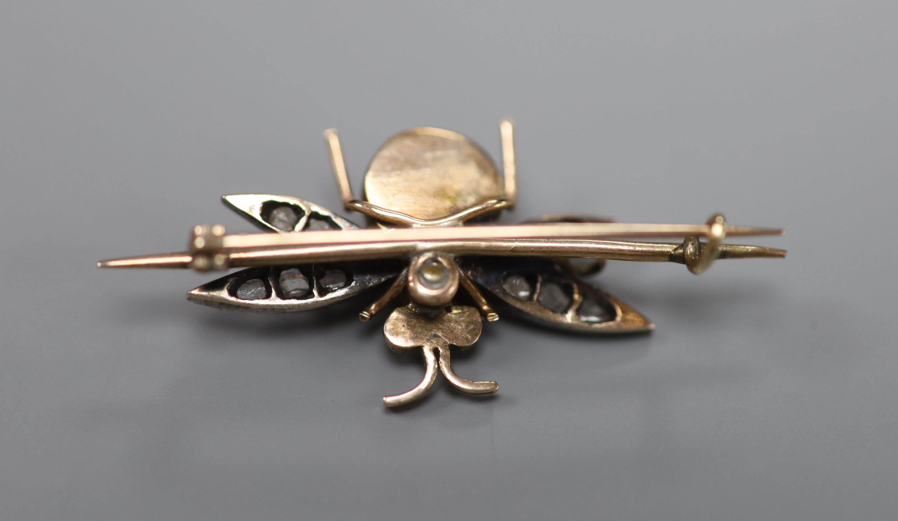 A Victorian yellow metal cats eye quartz?, garnet and rose cut diamond set bug brooch, overall 36mm, gross 2.5 grams.